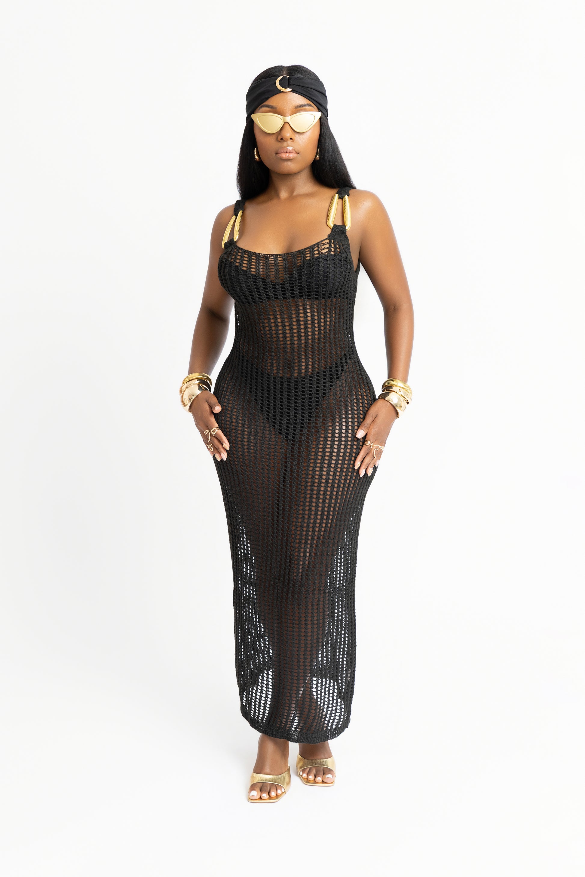 Black knit cover-up dress inspired by Havana. Features gold hardware, an open back, and a body-hugging fit. Perfect for beach-to-dinner glam.