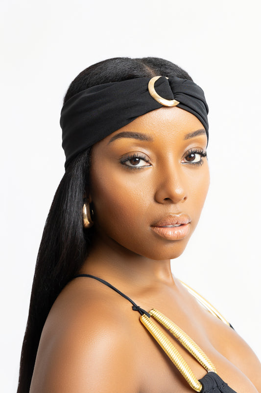Black turban headband with gold hardware. Inspired by Mykonos, Greece. One size fits all. A chic vacation-ready hair accessory.